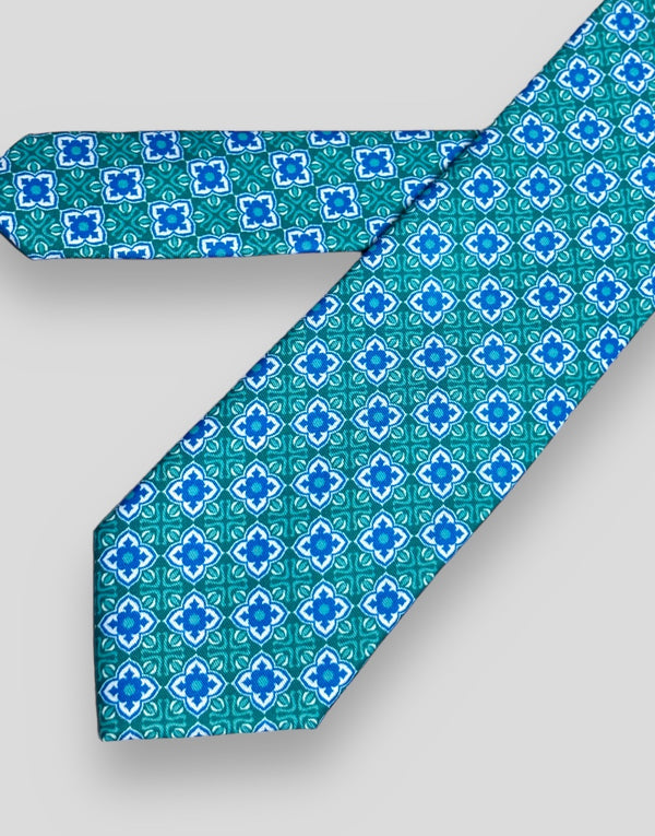 Corbata verde estampado mosaico azul